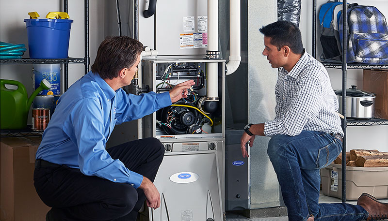 HVAC technician evaluating a furnace for repair or replacement in Fountain Hills