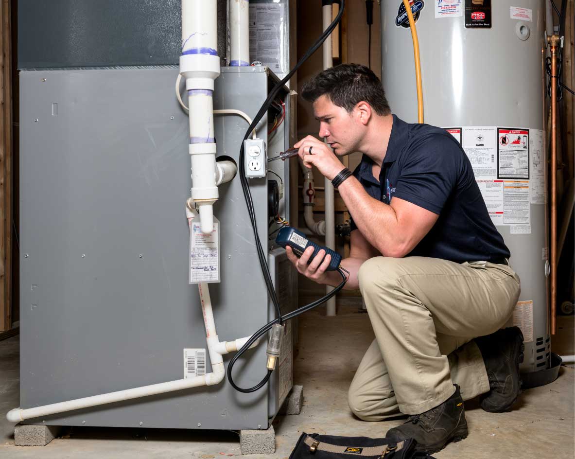HVAC technician performing a furnace tune-up in Fountain Hills