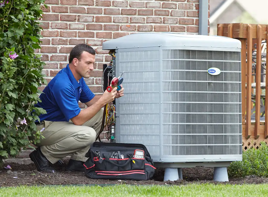 HVAC technician inspecting an outdoor air conditioning unit in Fountain Hills